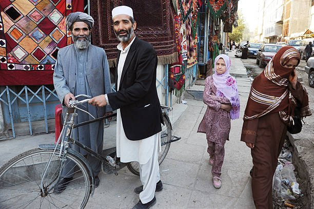 KABUL, AFGHANISTAN - OCTOBER 17: A street scene with Afghan people getting on with their daily lives in Chicken Street on October 17, 2011 in Kabul, Afghanistan. Chicken Street has been a focus for Afghanistan’s tourists since the days of the Hippy Trail. All kinds of handicrafts are available here, from jewellery to carpets, ‘antique’ muskets to poached furs. (Photo by Kaveh Kazemi/Getty Images)